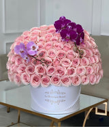 100 pink roses with orchids