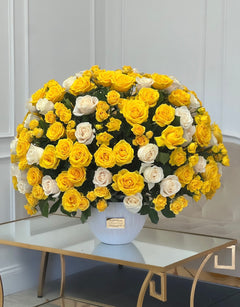 
                    
                      yellow roses in a vase
                    
                  