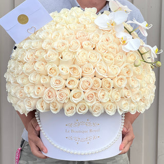 100 white roses and orchids