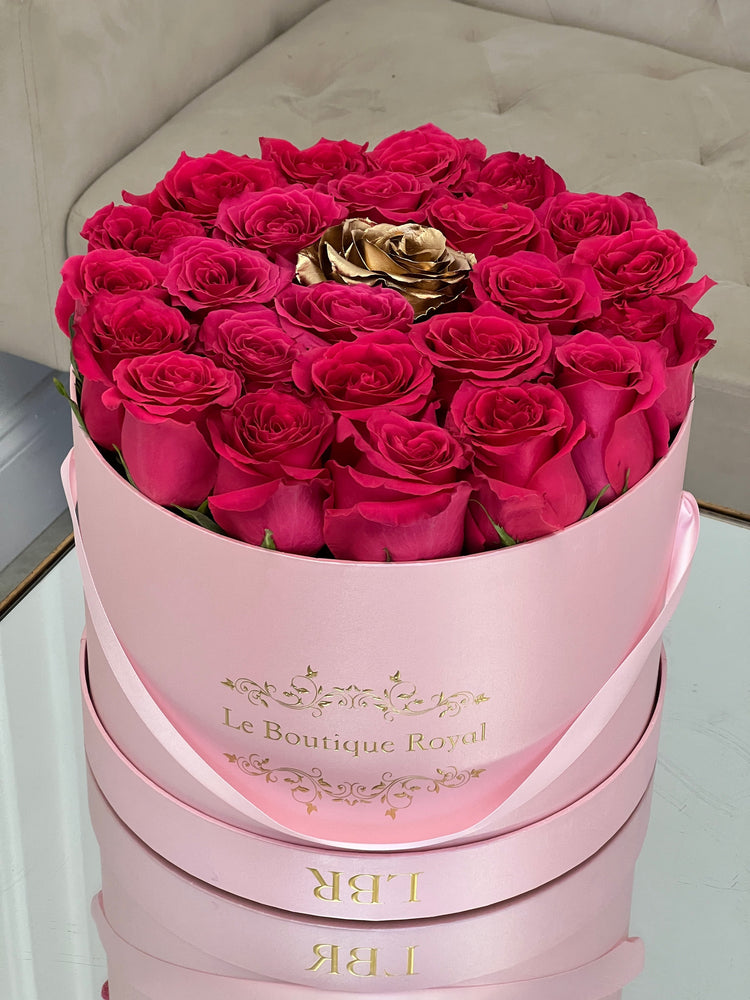 Hot Pink Roses With One Gold Rose