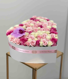 
                    
                      Luxury heart-shaped flower box with pink and white roses and a purple orchid by Le Boutique Royal in Miami.
                    
                  