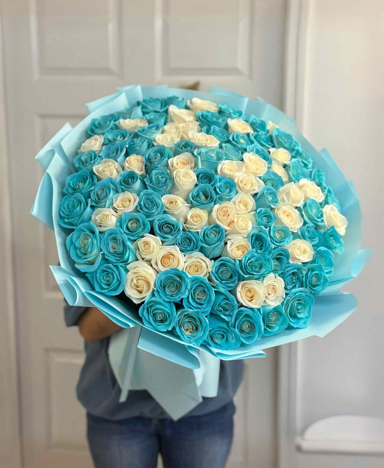 Luxury Tiffany blue and white rose bouquet featuring premium long stem roses in elegant blue wrapping.