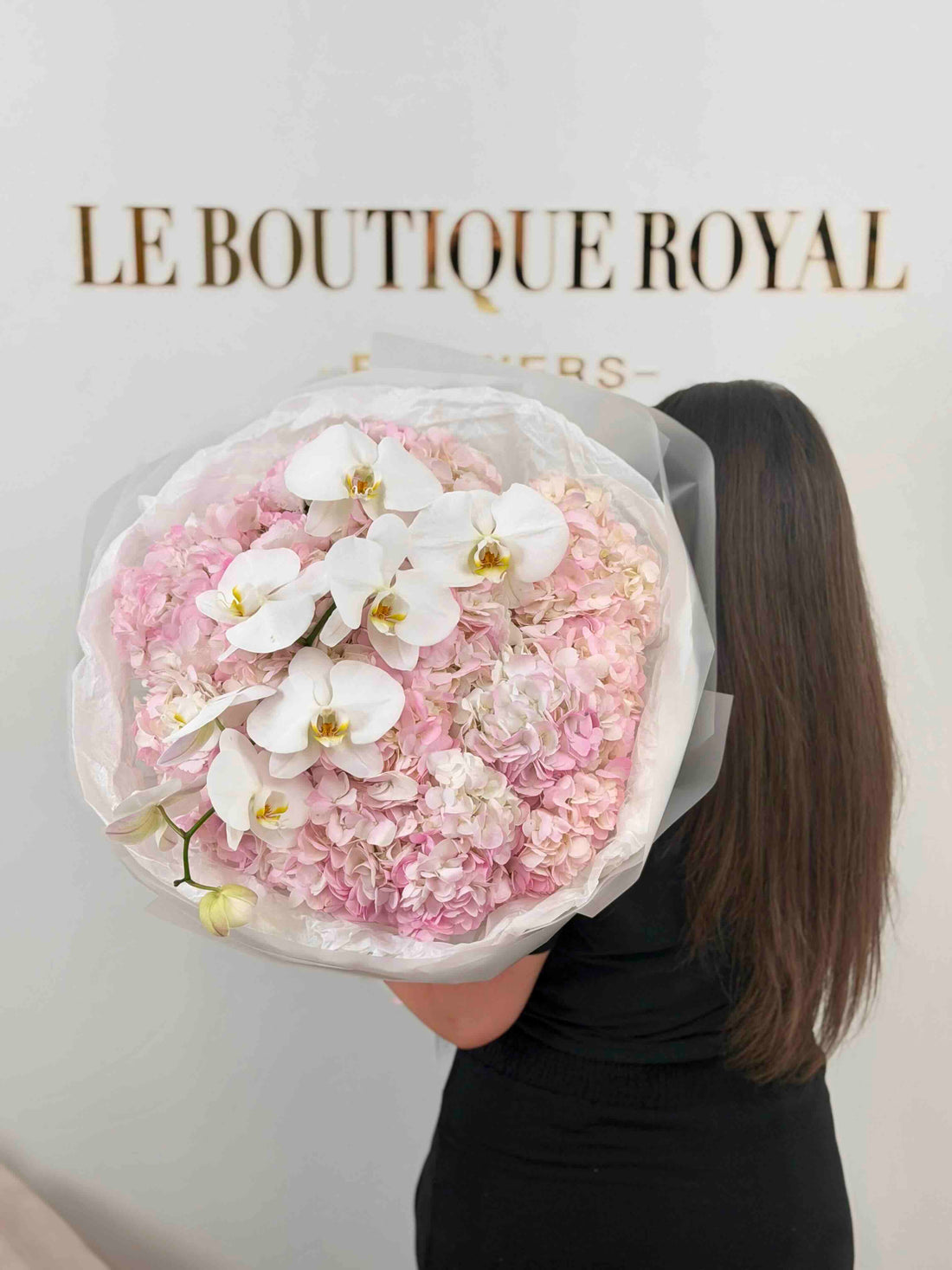 Luxury bouquet of blush pink hydrangeas and cascading white orchids