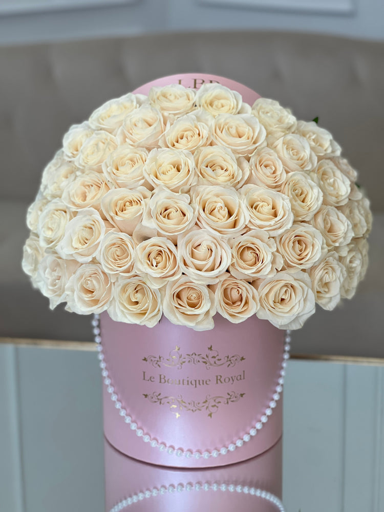 luxury white roses in a pink box