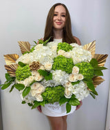 Mezcla de flores de lujo doradas y verdes