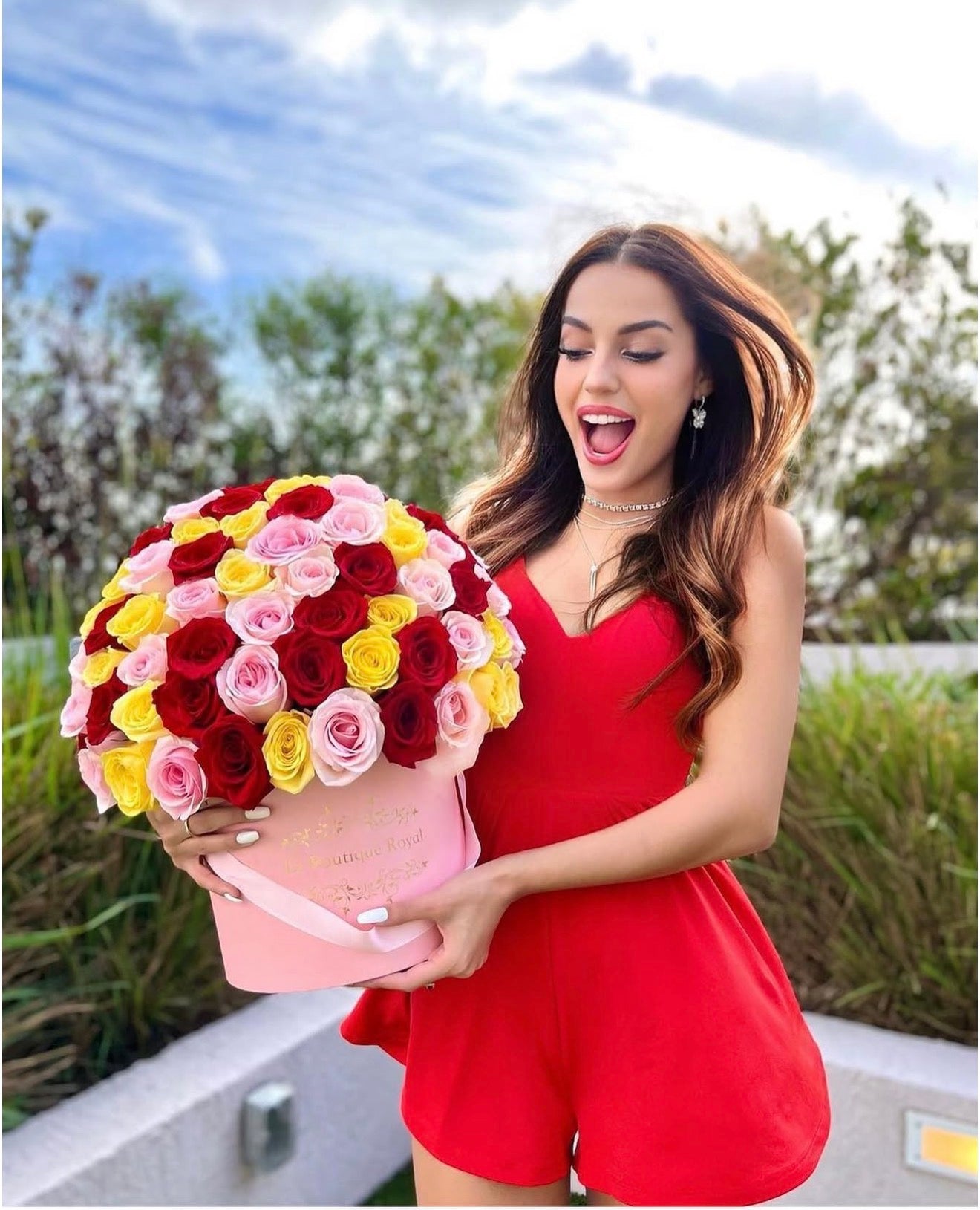 Le Boutique Royal customer gallery with a colorful rose bouquet