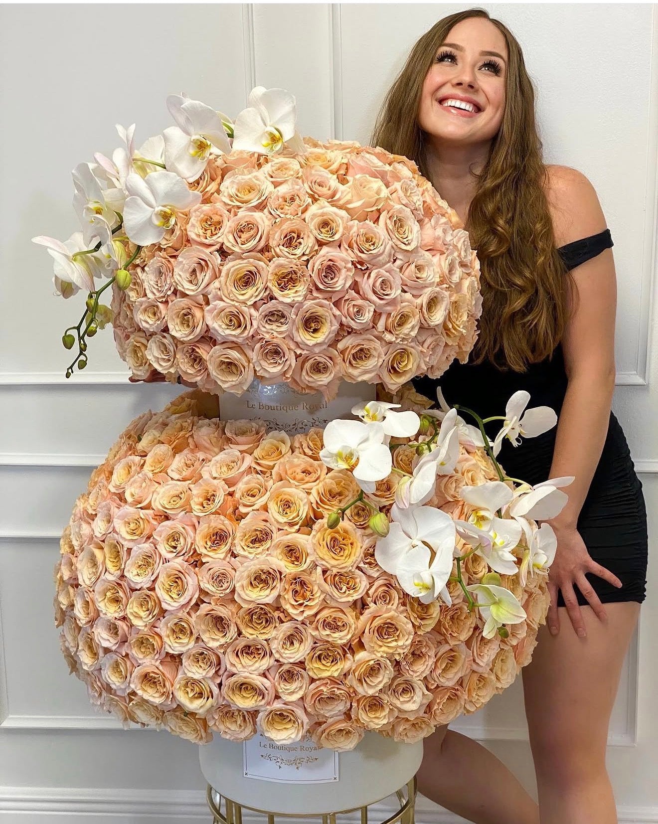 Le Boutique Royal customer gallery with peach rose arrangements