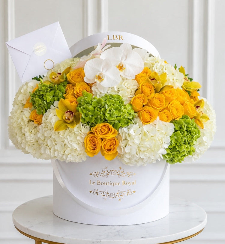 Luxury yellow, white and green flower arrangement with roses, hydrangeas and orchids in Miami